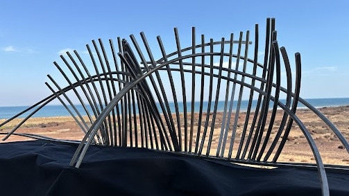 A mock-up of Ms Masero’s memorial sculpture, which would stand seven metres high on the reef. Picture: Elise Graham