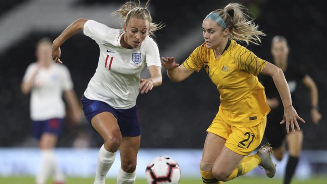 Toni Duggan turns on the after-burners to try and get past Ellie Carpenter. Picture: AP.