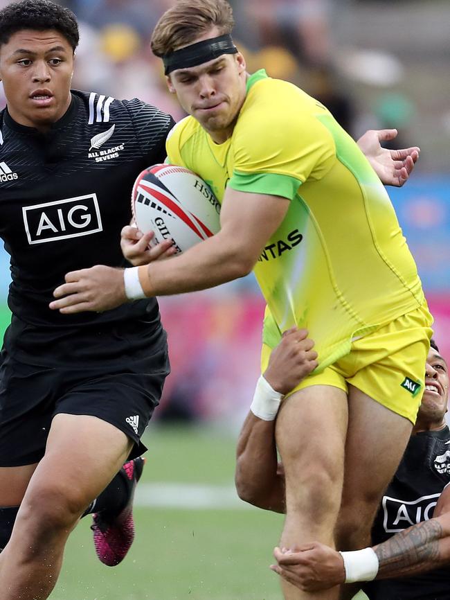 Taylor busts through a tackle during the World Rugby Sevens Series bronze medal match between New Zealand and Australia at Waikato Stadium in Hamilton earlier this year. Picture: Michael Bradley