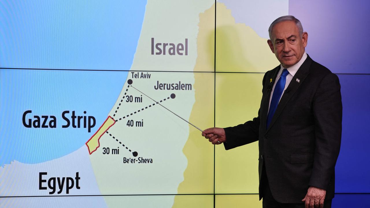 Israel's Prime Minister Benjamin Netanyahu points at Tel Aviv on a map during a press conference in Jerusalem on September 4. Picture: Abir Sultan/AFP