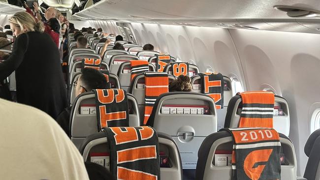 GWS leave scarves for passengers on a special Virgin flight from Sydney to Melbourne.