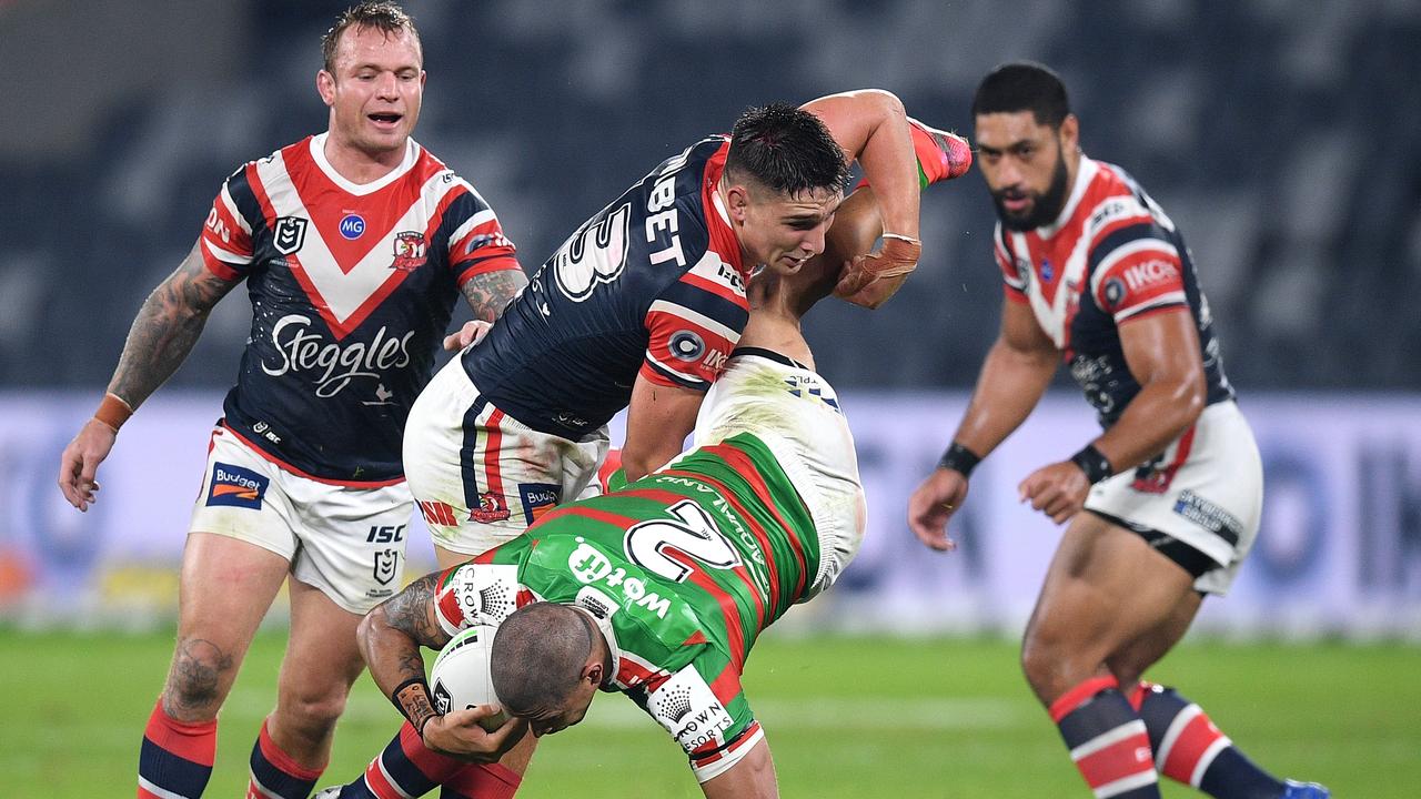 Dane Gagai of the Rabbitohs is tackled by Victor Radley.