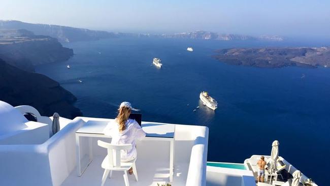 Madeleine Walkinshaw replying to emails in Greece. Picture: Instagram