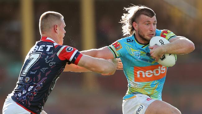 SYDNEY, AUSTRALIA - AUGUST 01: Jai Arrow of the Titans puts a fend on Kyle Flanagan of the Roosters during the round 12 NRL match between the Sydney Roosters and the Gold Coast Titans at the Sydney Cricket Ground on August 01, 2020 in Sydney, Australia. (Photo by Matt King/Getty Images)