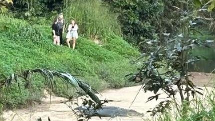 Three young women, believed to be to be tourists, spotted getting close and personal with a 4-metre saltwater crocodile, known by Babinda residents as 'Clyde'.