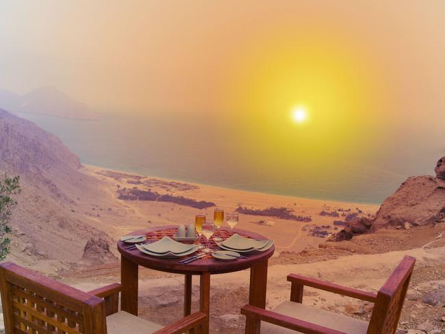 Dinner table setting overlooking Zighy Bay.