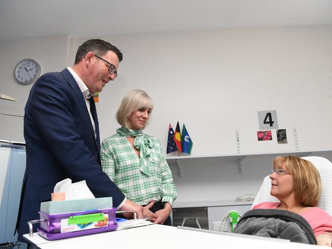 Victorian Premier Daniel Andrews (left) and wife Catherine (centre) speak with a patient at the Wangaratta Hospital in North East Victoria, Monday, October 29, 2018. The Labour Party is travelling to Wangaratta in the lead up to the 2018 Victorian state election. (AAP Image/James Ross) NO ARCHIVING