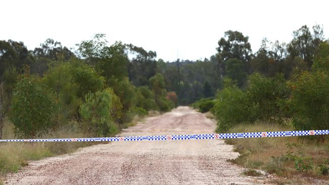 The road leading into Wains Road at Wieambilla was guarded by police on Tuesday. Picture: David Clark NCA/Newswire