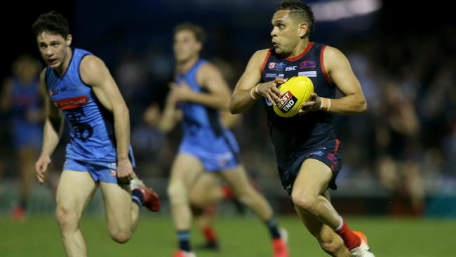 Norwood’s Dom Barry bursts down The Parade wing against Sturt on Friday night. Picture: Dean Martin