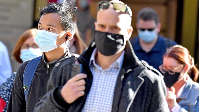 People wearing masks in Brisbane’s CBD this week. Picture: NCA NewsWire / John Gass