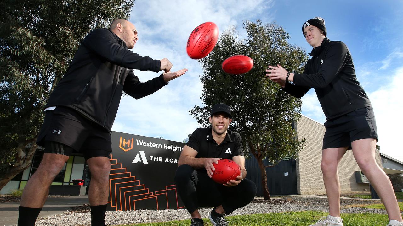 Alex Rance, pictured centre in 2020 with Western Heights academy lead teacher Alex Tortora, left, and student Nathan Sutcliffe. Picture: Alison Wynd