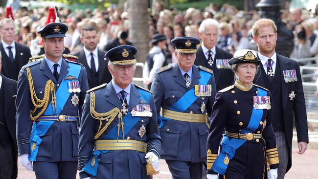 Prince William, Prince of Wales, King Charles III, Prince Richard, Duke of Gloucester, Anne, Princess Royal and Prince Harry, Duke of Sussex walk behind the coffin during the procession for the Lying-in State of Queen Elizabeth II.