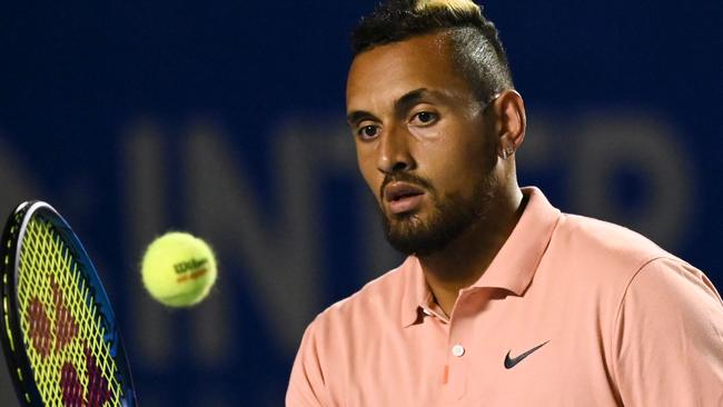 Why not an official, dressed in the black face mask of a medieval executioner, who applies a zap each time Nick Kyrgios complains about the colour of the towels? Picture: AFP