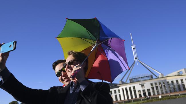 Same-sex marriage supporters outside Parliament House in Canberra. Picture; AAP.