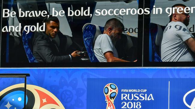 Australia football team's player Andrew Nabbout (L) sits in the bus upon the arrival in Kazan.