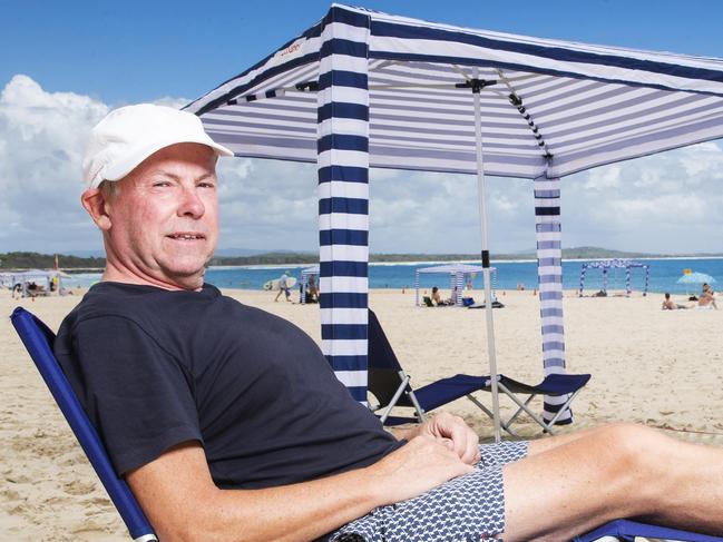 QLD architect Mark Fraser who created the Cool Cabana beach umbrella on Noosa Main Beach. Picture Lachie Millard