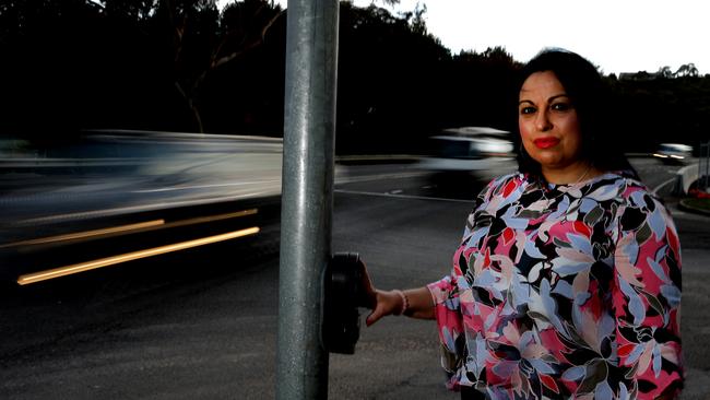 Mary Loughland is a psychic and tarot reader and has felt many ghostly goings-on along the Parkway. She is pictured at the crossing at the C3 Church at Oxford Falls. Picture: Martin Lange