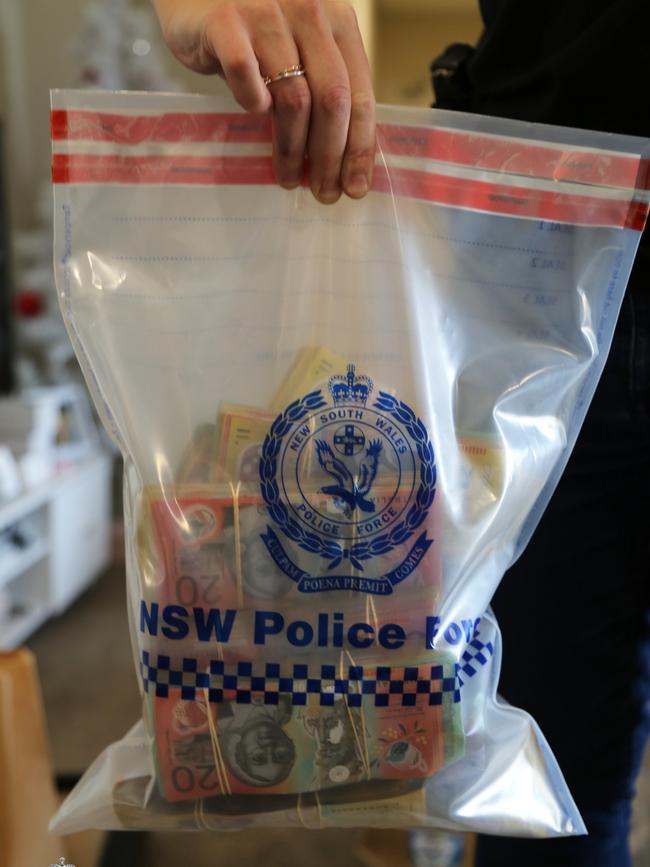 The cash was found stashed in a handbag, envelopes, shopping bags and a shoebox. Picture: NSW Police