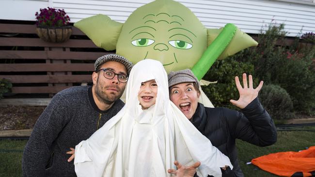 Archie Lyall, 4, with parents Gavin and Viv Lyall trick or treating on Halloween in Newtown, Sunday, October 31, 2021. Picture: Kevin Farmer