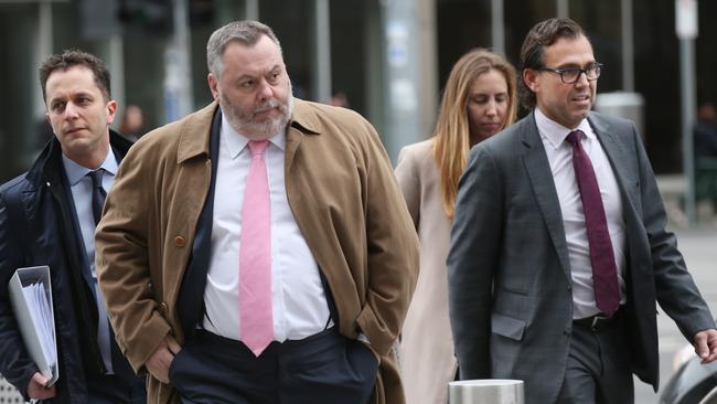 Legal representatives for Israel Folau, Stuart Wood (centre) and George Faros arrive at the Federal court in Melbourne. Picture: David Crosling