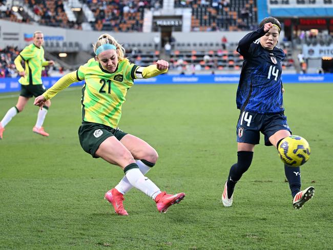 Ellie Carpenter gets a cross away in a rare moment of attack for the Matildas Picture: Getty Images