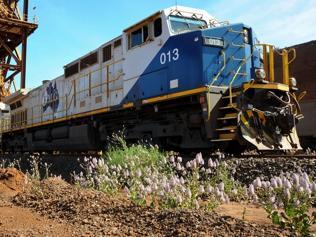 A Fortescue Metals Group train is loaded with iron ore to be transported to the company's Port Hedland facility for export, a...