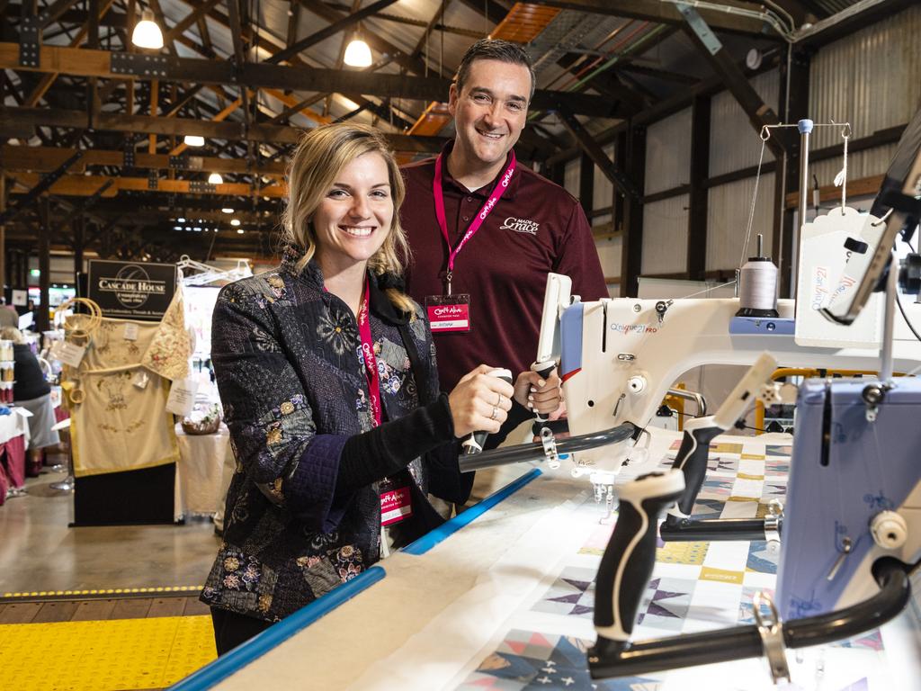 American visitors Janessa Kimball and Nathan Erznoznik of The Grace Company demonstrate quilting machines at Craft Alive at the Goods Shed, Saturday, May 21, 2022. Picture: Kevin Farmer