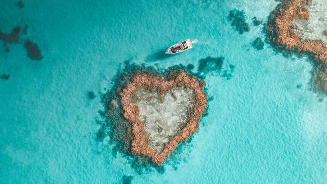 The helicopter trip takes you over the Heart Reef lagoon.