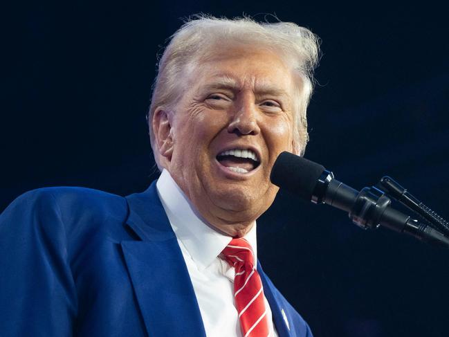 PHOENIX, ARIZONA - DECEMBER 22: U.S. President-elect Donald Trump speaks during Turning Point USA's AmericaFest at the Phoenix Convention Center on December 22, 2024 in Phoenix, Arizona. The annual four day conference geared toward energizing and connecting conservative youth hosts some of the country's leading conservative politicians and activists.   Rebecca Noble/Getty Images/AFP (Photo by Rebecca Noble / GETTY IMAGES NORTH AMERICA / Getty Images via AFP)