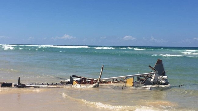 A boat was smashed to pieces by waves in just one night near Double island Point on the weekend. Photos: Clayton's Towing