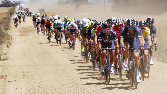 Riders hit the gravel road moments before the race was neutralised. Picture: Michael Klein