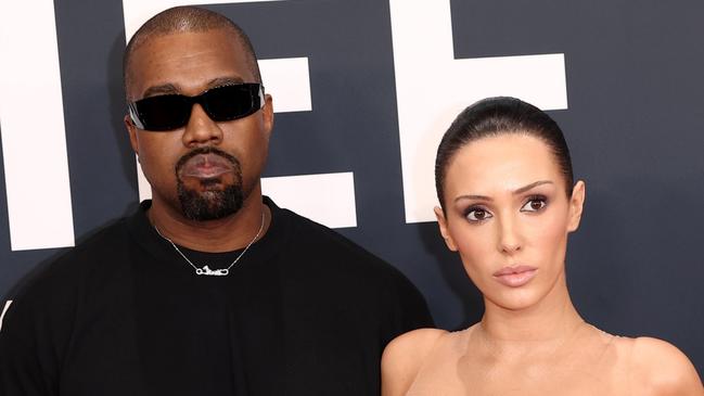 PIXELATED VERSIONS -  LOS ANGELES, CALIFORNIA - FEBRUARY 02: (EDITOR'S NOTE: Image contains nudity.) L-R, Kanye West and Bianca Censori attend the 67th Annual GRAMMY Awards on February 02, 2025 in Los Angeles, California.  (Photo by Matt Winkelmeyer/Getty Images for The Recording Academy)