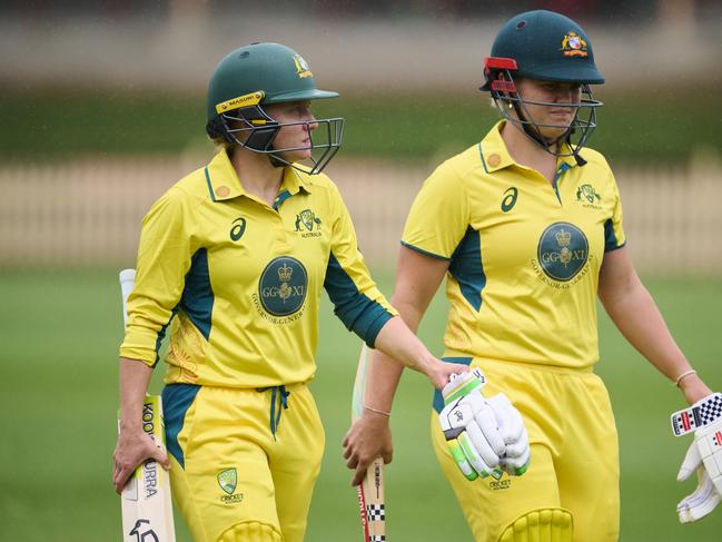 SYDNEY, AUSTRALIA - JANUARY 09: Alyssa Healy of Australia and Georgia Voll of Australia walk from the field as rain delays the match during the One Day match between Governor General's XI and England Women at North Sydney Oval, on January 09, 2025, in Sydney, Australia. (Photo by Brett Hemmings/Getty Images)