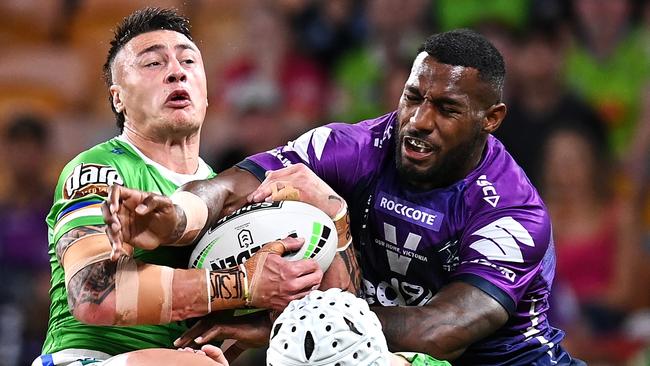 Raiders fullback Charnze Nicoll-Klokstad competes with the Storm’s Suliasi Vunivalu for possession at Suncorp Stadium. Picture: Getty Images