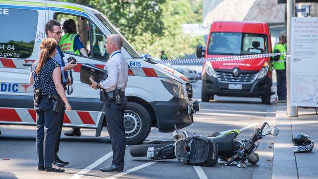 Paramedics and police at Russell St. Picture: Jason Edwards