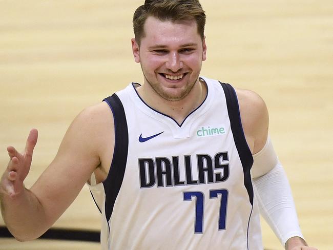 (FILES) In this file photo taken on May 25, 2021 Luka Doncic #77 of the Dallas Mavericks smiles after a 127-121 Dallas Mavericks win over the LA Clippers in game two of the Western Conference first round series at Staples Center in Los Angeles, California. - Slovenian NBA All-Star guard Luka Doncic and the Dallas Mavericks have agreed to terms on a five-year contract extension worth $207 million, according to multiple US media reports August 9, 2021. (Photo by Harry How / GETTY IMAGES NORTH AMERICA / AFP)