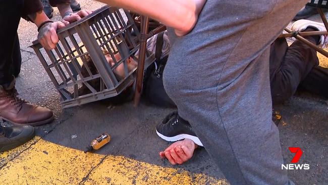 A milk crate was also used to subdue the alleged knife attacker. Picture: Seven News