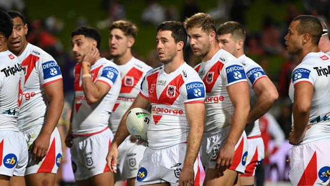 A dejected Dragons group wait behind the posts after conceding a try. Credit: NRL Images.