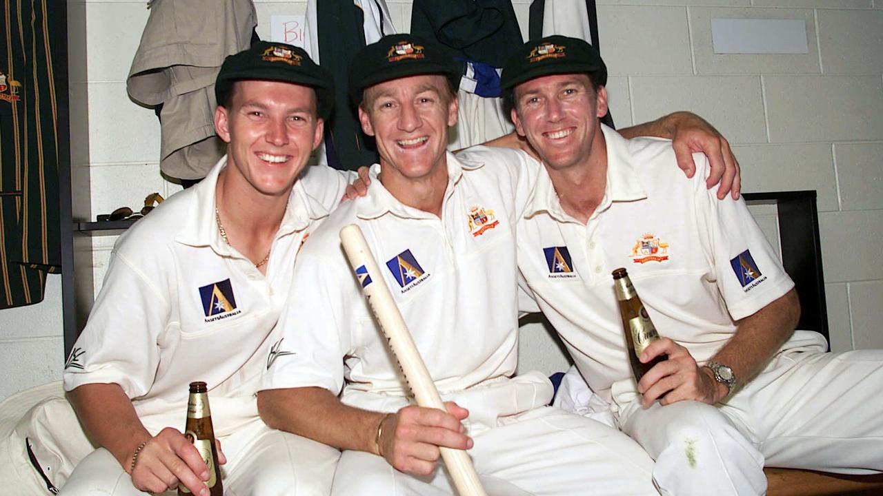 Brett Lee with Andy Bichel and Glenn McGrath drink a beer after winning a Test match.