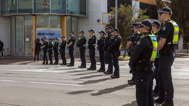 Victoria Police form a line in anticipation of protest actions as Extinction Rebellion demonstrators march against the Land Forces Convention. Picture: NewsWire/Tamati Smith.