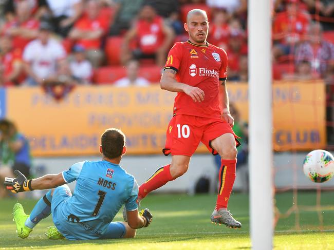 ADELAIDE, AUSTRALIA - DECEMBER 08: James Troisi of Adelaide United   scores his teams second goal past Glen Moss goalkeeper of Newcastle Jets  during the round nine A-League match between Adelaide United and the Newcastle Jets at Coopers Stadium on December 08, 2019 in Adelaide, Australia. (Photo by Mark Brake/Getty Images)