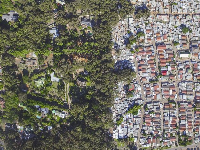 Unequal Scenes: Segregation of urban spaces in South Africa. Picture: Johnny Miller/Millefoto/Rex Shutterstock/Australscope