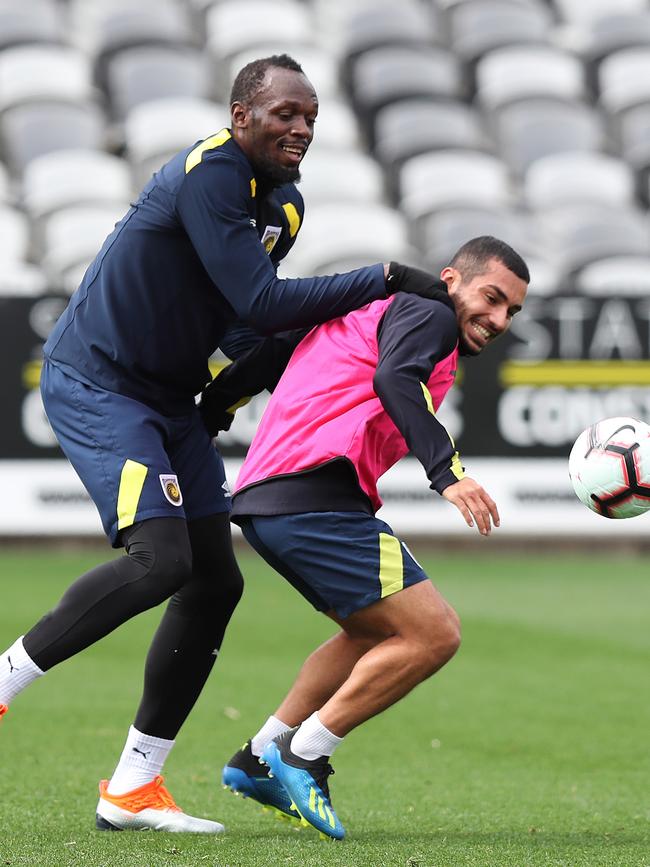 Usain Bolt with Mario Shabow during Central Coast Mariners training at Central Coast Stadium. Picture: Brett Costello