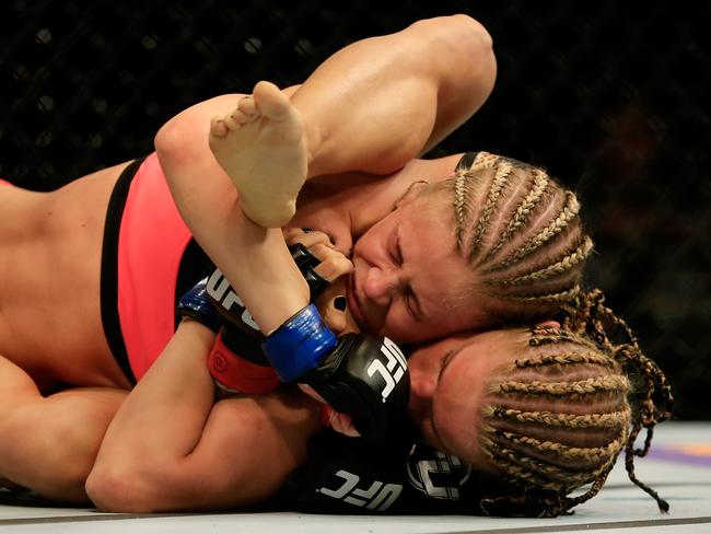 Felice Herrig and Paige VanZant grapple in their women's strawweight bout.