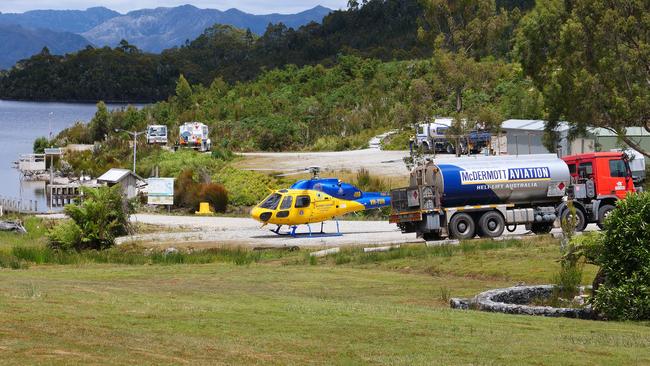 A helicopter on the ground at Lake Pedder as part of efforts to tackle the Gell River fire in the South West World Heritage area. Picture: SUPPLIED/Seven Tasmania