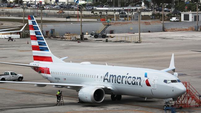 MIAMI, FL - MARCH 14: A grounded American Airlines Boeing 737 Max 8 is seen parked at Miami International Airport on March 14, 2019 in Miami, Florida. The Federal Aviation Administration grounded the entire United States Boeing 737 Max fleet.   Joe Raedle/Getty Images/AFP == FOR NEWSPAPERS, INTERNET, TELCOS & TELEVISION USE ONLY ==