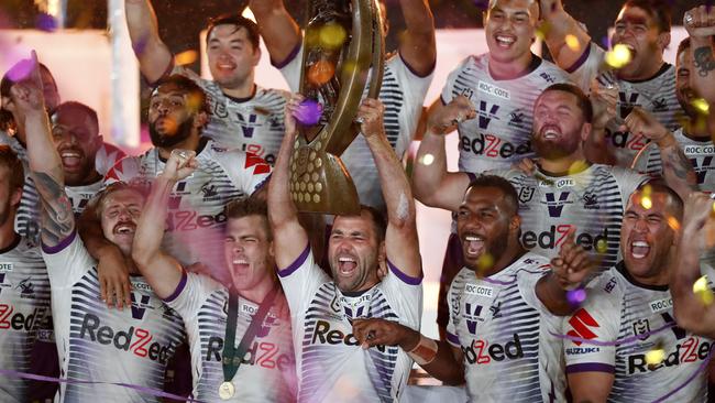 Melbourne's Cameron Smith lifts the trophy after defeating the Penrith Panthers in the NRL Grand Final at ANZ Stadium in Sydney on Sunday night. Picture: Jonathan Ng