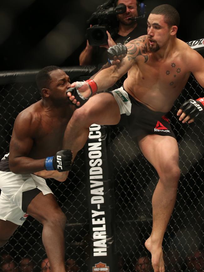 Sydney’s Robert Whittaker (right) announced himself as a UFC title contender in November last year with his knock-out victory over the highly-rated Derek Brunson. Photo: David Crosling