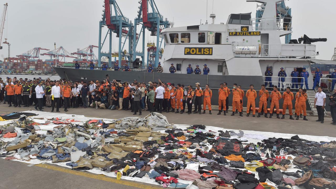 Recovered debris from the ill-fated Lion Air flight laid out as Indonesia's President Joko Widodo visits the search and rescue operations centre last year. Picture: AFP 