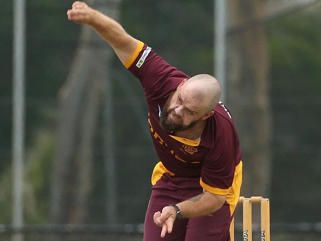 Aaron Shellie rolls the arm over for Coburg. Picture: Hamish Blair